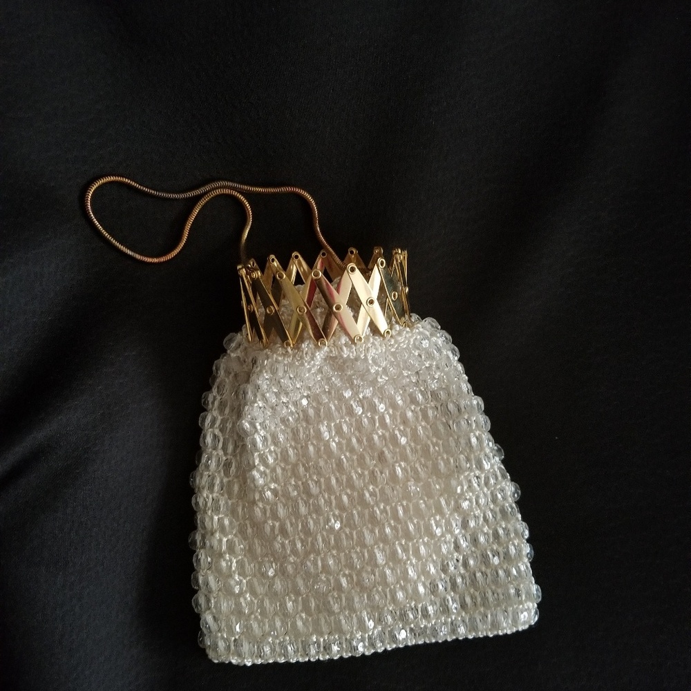 Vintage crocheted beaded handbag with snake chain